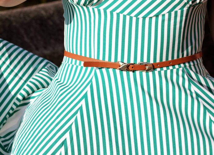 Belt and striped dress