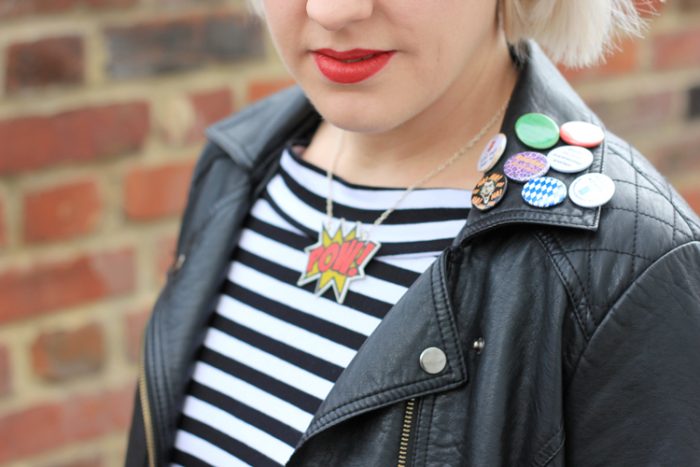 Leather jacket with button badges