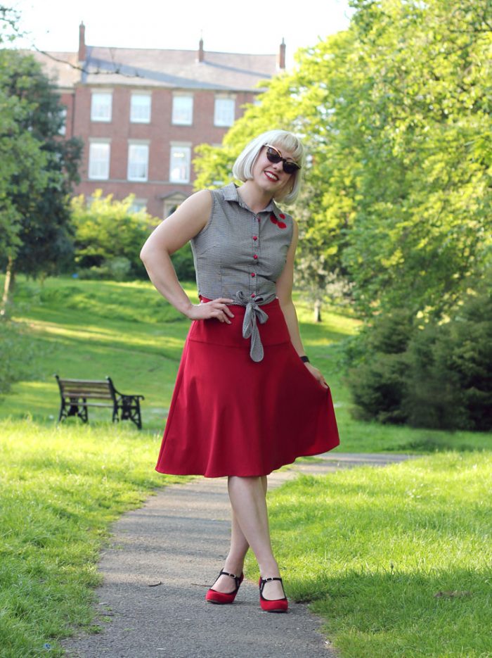 Red suede shoes and red knee length skirt